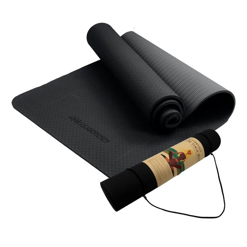 Black 6mm TPE yoga mat rolled with a carry strap